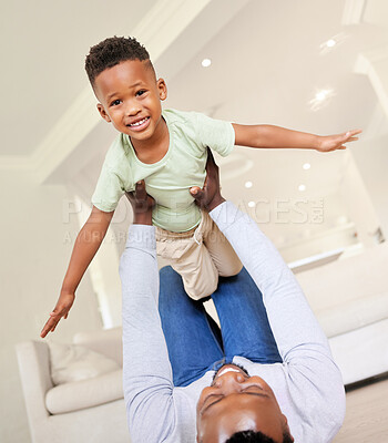 Buy stock photo Airplane, smile and portrait of child with father in the living room of modern house having fun. Happy, love and young African boy kid playing with his dad on the floor of the lounge at home together