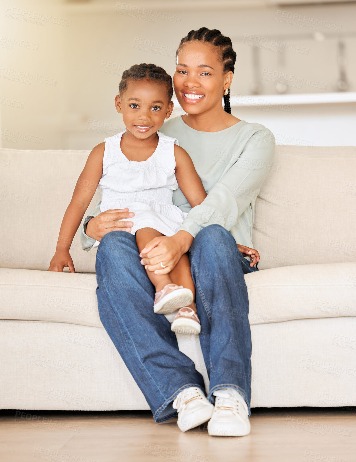 Buy stock photo Mom, sofa or daughter on lap in portrait, love or happy family for wellness in living room. Black people, woman and child together with smile face, bonding or weekend with gratitude support in house