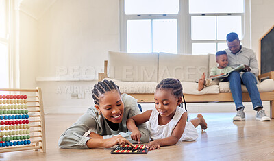 Buy stock photo Education, happy and black woman playing with child on the floor in the living room at modern home. Abacus, mathematics and young African mother helping girl kid with counting at house together.