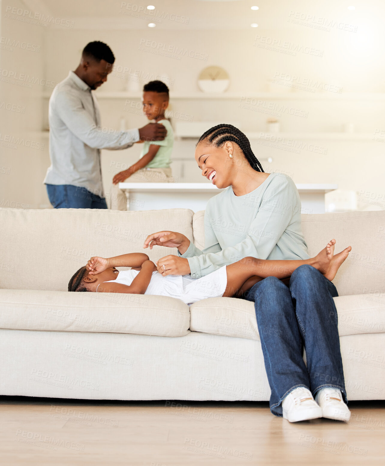Buy stock photo Mother, child and tickle on couch, play and bonding together at home, fun and care in living room. Black family, daughter and love in connection, comedy and silly or goofy, laughing and happiness