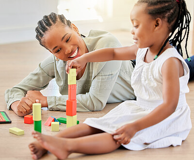 Buy stock photo Family on the floor, mother and girl with blocks, playful and fun with happiness, weekend break and relaxing. Mama, apartment and kid with child development, home and building tower with wooden toys