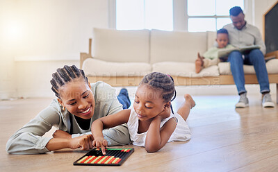 Buy stock photo Education, smile and black woman playing with kid on the floor in the living room at modern home. Abacus, mathematics and young African mother helping girl child with counting at house together.