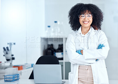 Buy stock photo Portrait of proud african american scientist wearing safety goggles in her office. Smiling medical professional with her arms crossed wearing a lab coat in the lab. Powerful scientific expert at work