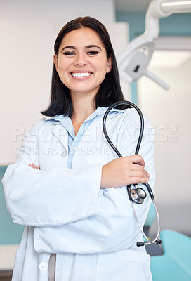Buy stock photo Stethoscope, crossed arms and portrait of woman dentist with confidence in her office at the clinic. Happy, medical and young female orthodontist or dental doctor with positive attitude in hospital.