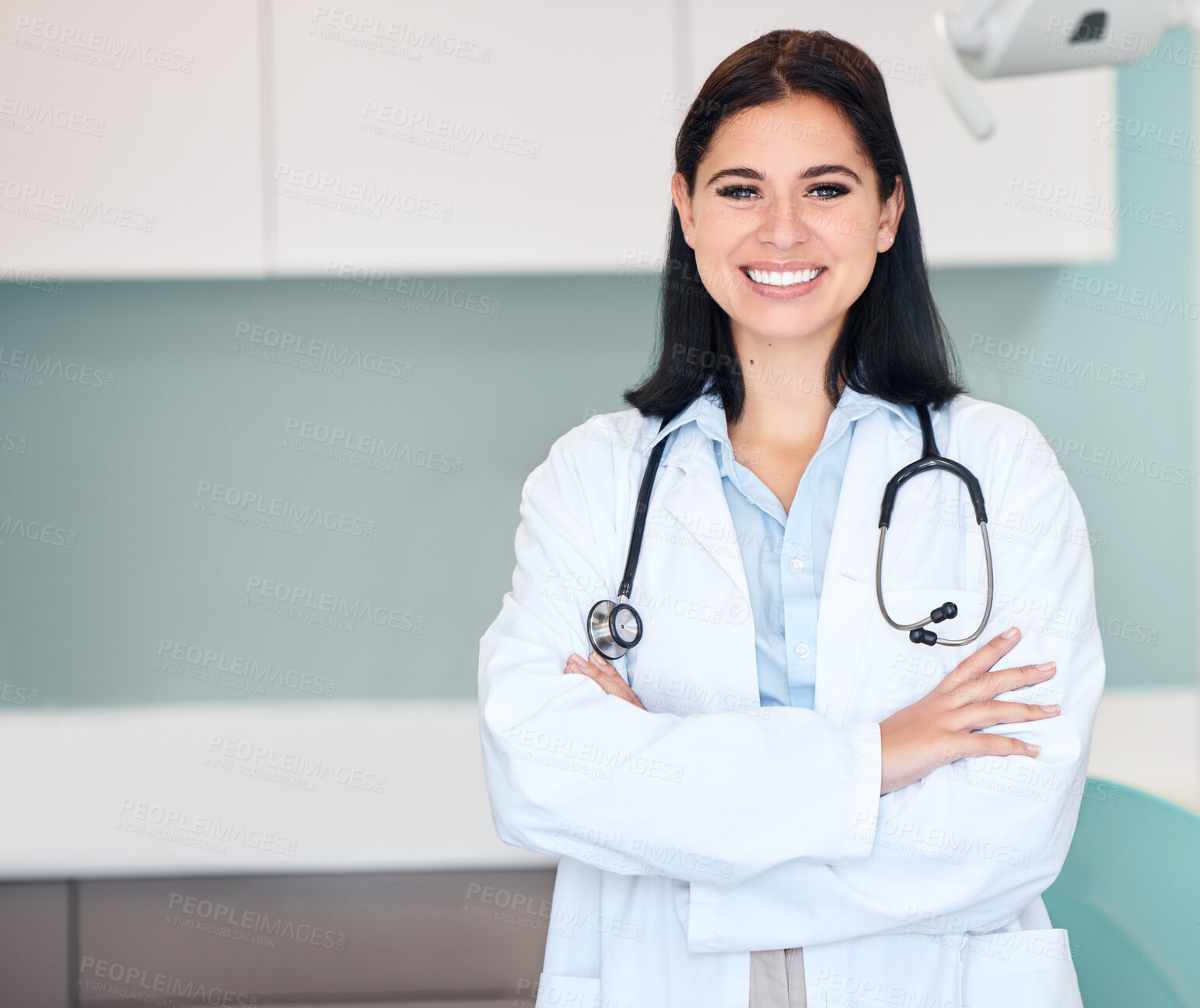 Buy stock photo Happy woman, doctor and portrait of medical professional or dentist with arms crossed and stethoscope. Female person, surgeon or qualified healthcare expert smile in confidence at hospital clinic