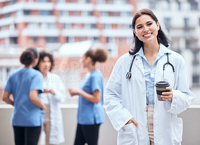 Buy stock photo Woman, doctor and portrait of happy coffee break, outdoor and relax at hospital, clinic or colleagues on rooftop. Surgeon, smile and enjoy drink on balcony and working in healthcare and medicine 