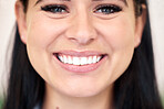 Closeup of a beautiful caucasian woman giving a toothy smile to the camera. Showing off the fruits of her dental hygiene regime. Understanding the importance of oral hygiene and happy with the results