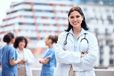 Buy stock photo Woman, doctor and happy portrait outdoor with arms crossed at hospital, clinic or colleagues on rooftop for a break., Surgeon, smile and confidence on balcony and working in healthcare and medicine