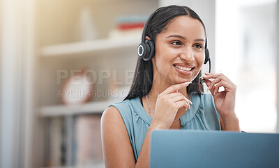 One young hispanic happy and cheerful female call center agent wearing a headset and working in customer service at work. Face of a hispanic woman answering calls working at a call centre on a laptop