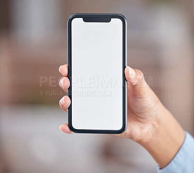 Buy stock photo Unrecognizable cropped view of a mixed race woman holding holding a smartphone against a blurred background while showing a white screen. Unknown female shower her wireless device as part of a advertisement 
