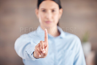 Closeup of of the hand in the foreground of a mixed race businesswoman gesturing stop or wait while standing in her office. Stop gender based violence and sexual harassment in the workplace. Take a stand. Female looking upset and showing a hand gesture in