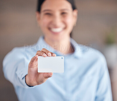 A businesswoman holding a blank card. Portrait of a female showing a business tag, pass or id. Woman with a covid passport or badge at a conference or convention. Contact referral or security access