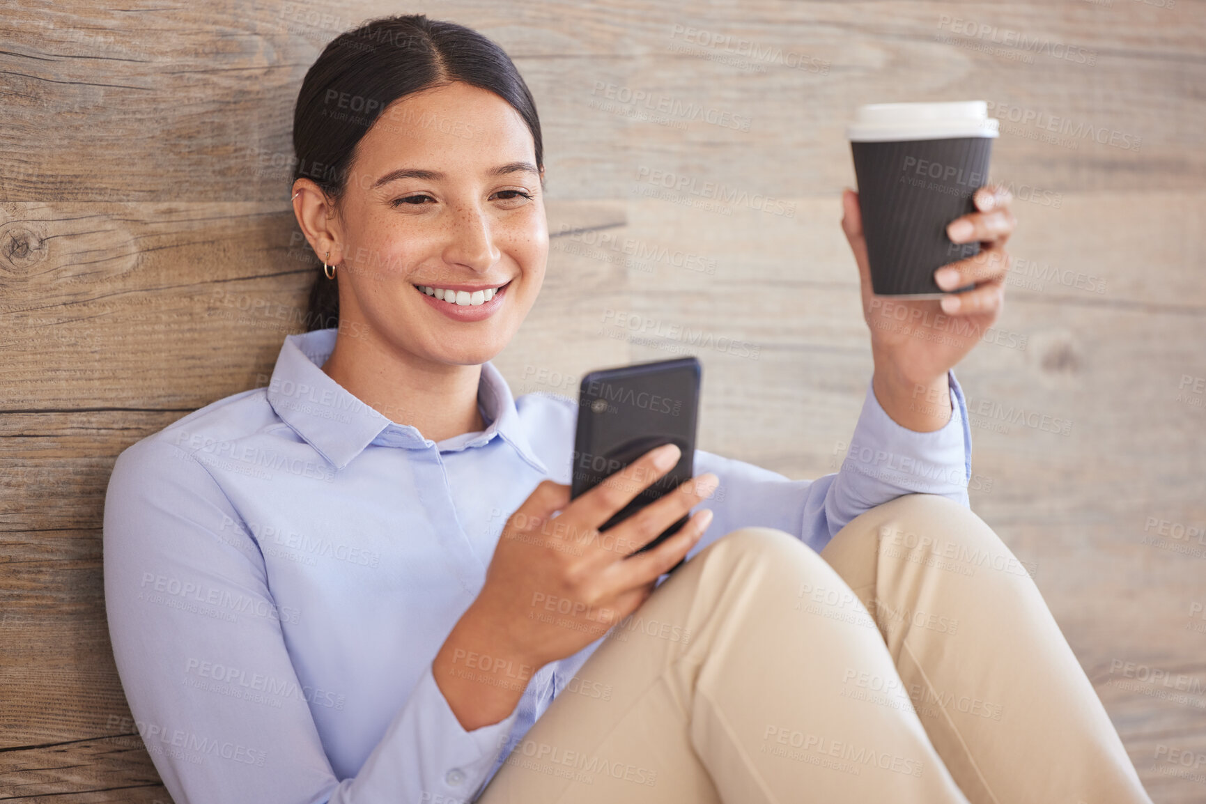 Buy stock photo Businesswoman on floor with phone, smile and coffee break browsing internet, social media meme or texting. Happy woman, paper cup and cellphone, relax and checking online post or good news in office.