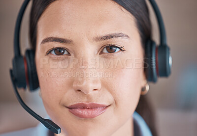Closeup face of mixed race agent wearing headset. Call centre agent offering support. Woman answering calls, helping clients from an office. Headshot of customer service representative