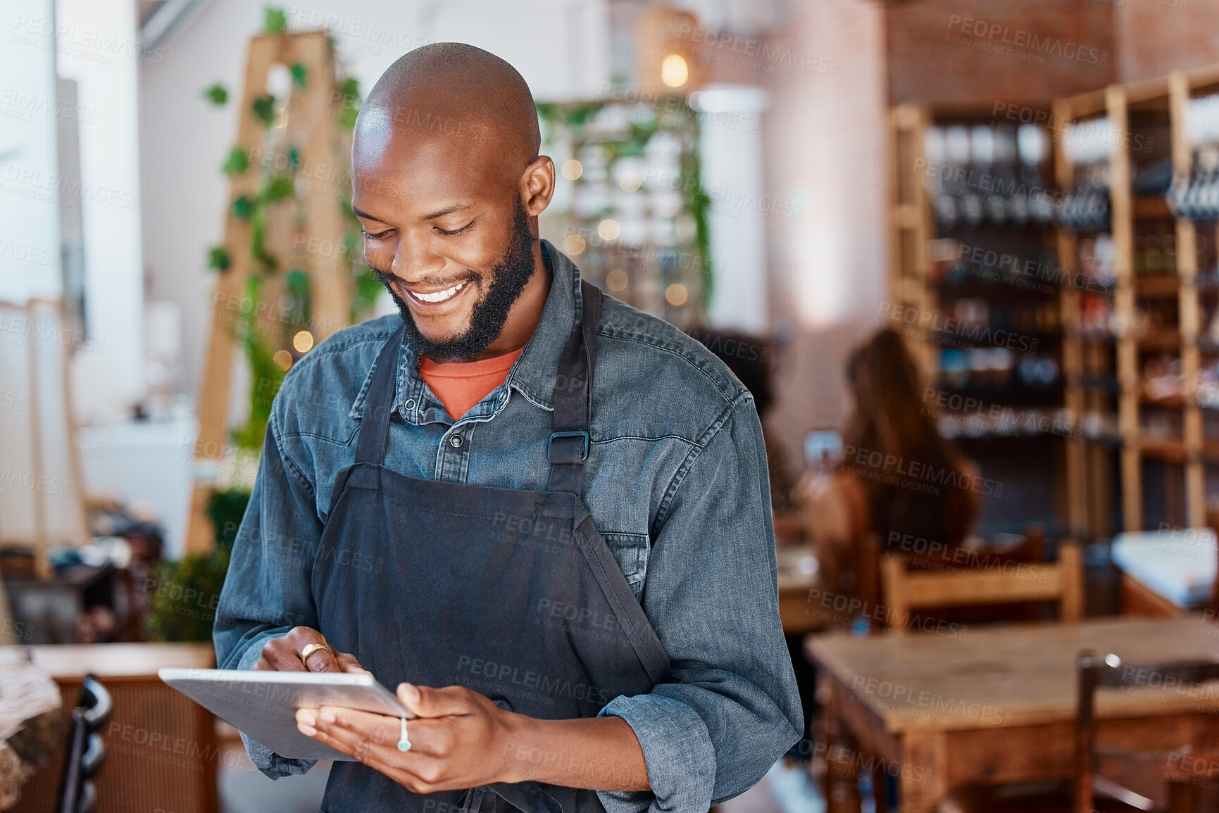 Buy stock photo Restaurant, tablet and black man or small business owner, e commerce and online cafe or coffee shop management. Waiter or happy person reading sales on digital technology or internet for his startup