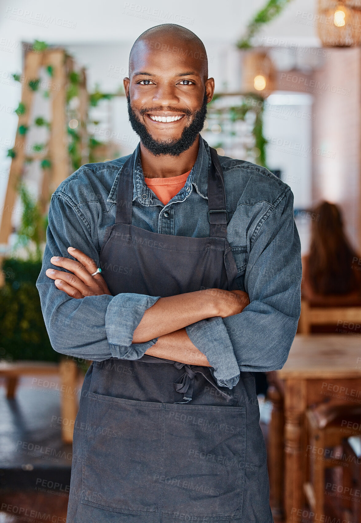 Buy stock photo Portrait, cafe and black man with arms crossed, barista and service with happiness, proud and startup success. Face, happy male person and business owner with confidence, coffee shop and restaurant