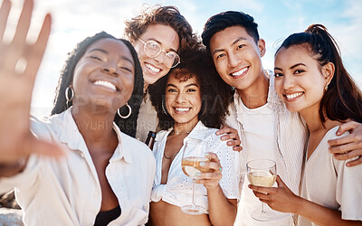 Buy stock photo Portrait of a happy group of friends talking a selfie while at the beach