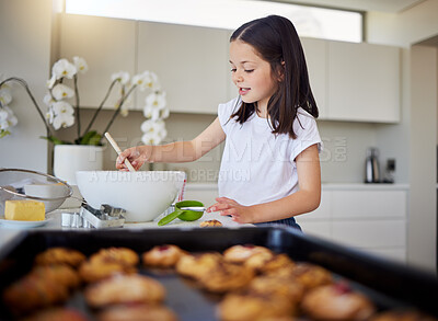 Buy stock photo Happy little girl baking at home. Smart girl mixing batter in bowl in the kitchen. Helpful child in the kitchen
