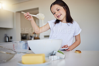 Buy stock photo Happy little girl baking at home. Smart girl mixing ingredients to to bake cake and checking consistency