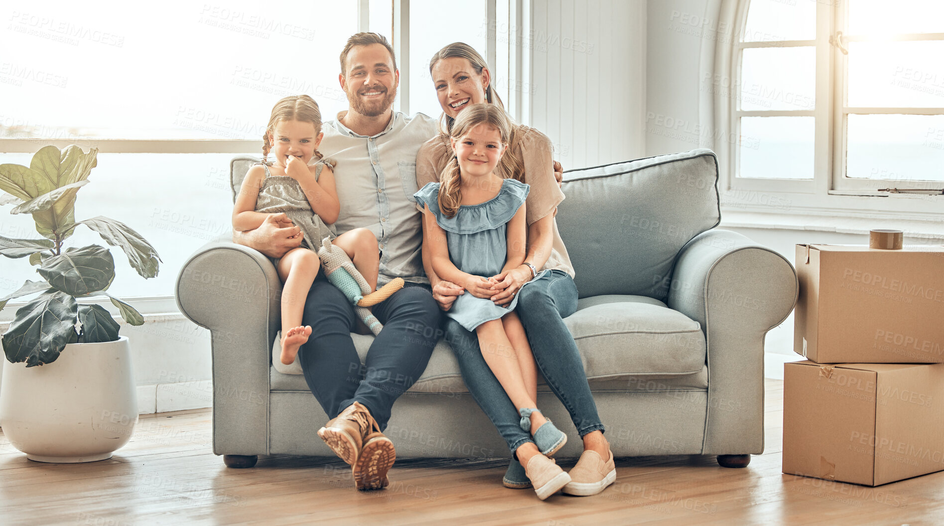 Buy stock photo New home, sofa and portrait of parents and children in living room for bonding, quality time and relax together. Happy family, support and mom and dad with girls for care, love and smile in house