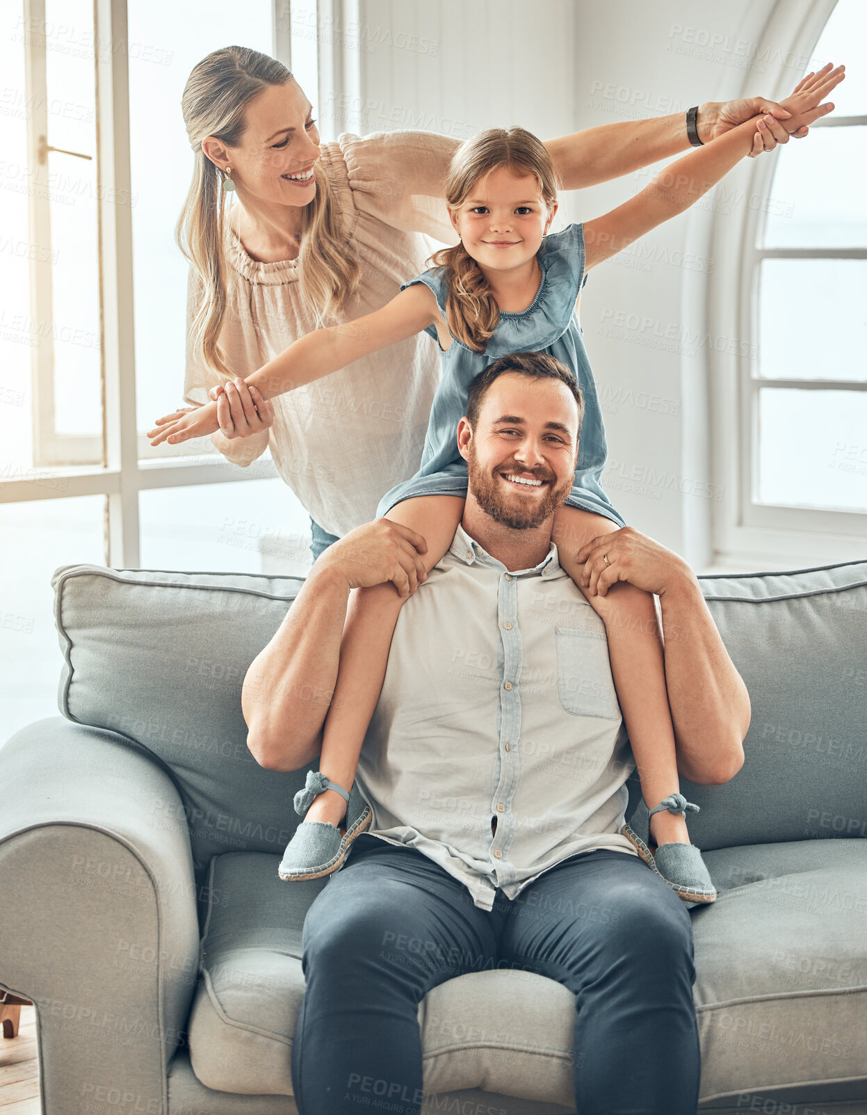 Buy stock photo Happy family, portrait and child on sofa with flying game, piggy back and play in living room for man and woman. Mother, father and kid playing airplane games on couch with smile, happiness and love.