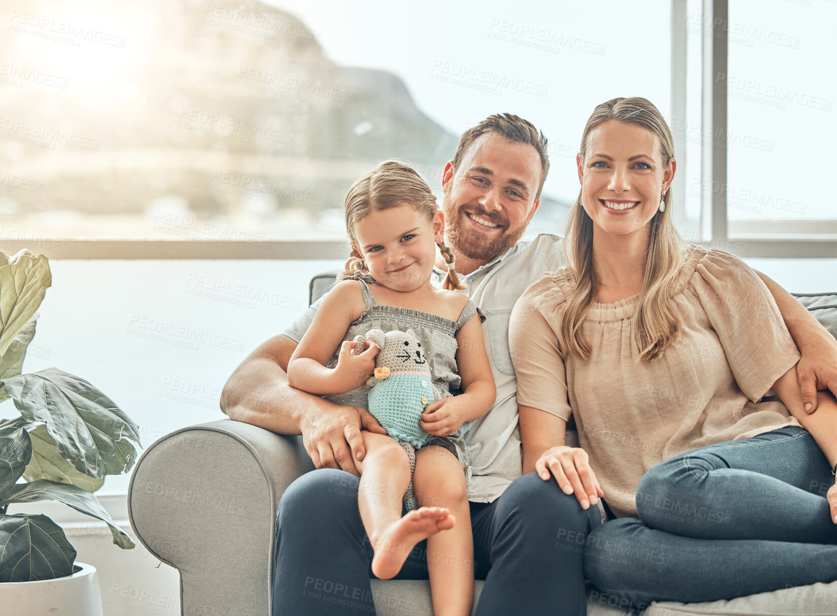 Buy stock photo Portrait of mother, father and child on sofa in living room for bonding, quality time and relax together. Happy family, smile and mom and dad with girl for care, love and happiness at home on weekend