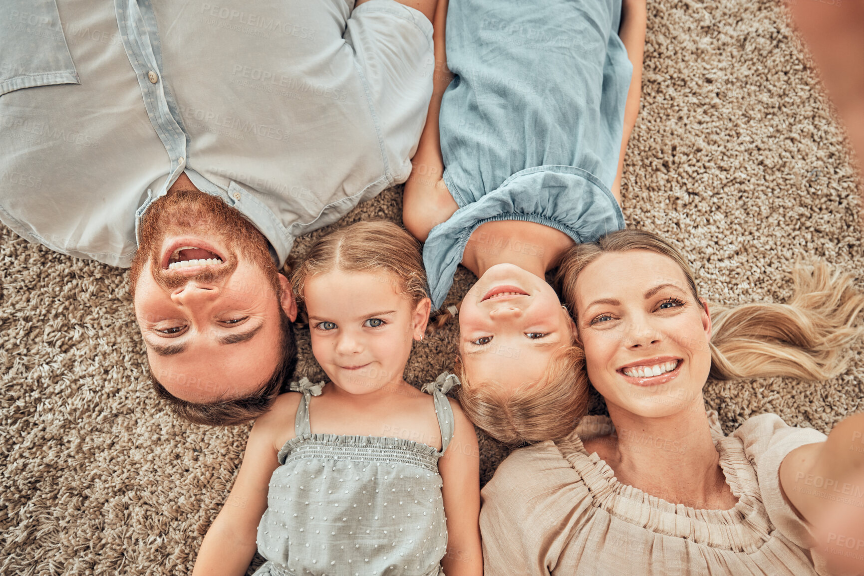 Buy stock photo Top view, selfie and portrait of parents and children on living room floor for bonding, quality time and relax. Happy family, smile and mom and dad with girls for care, love and take picture at home