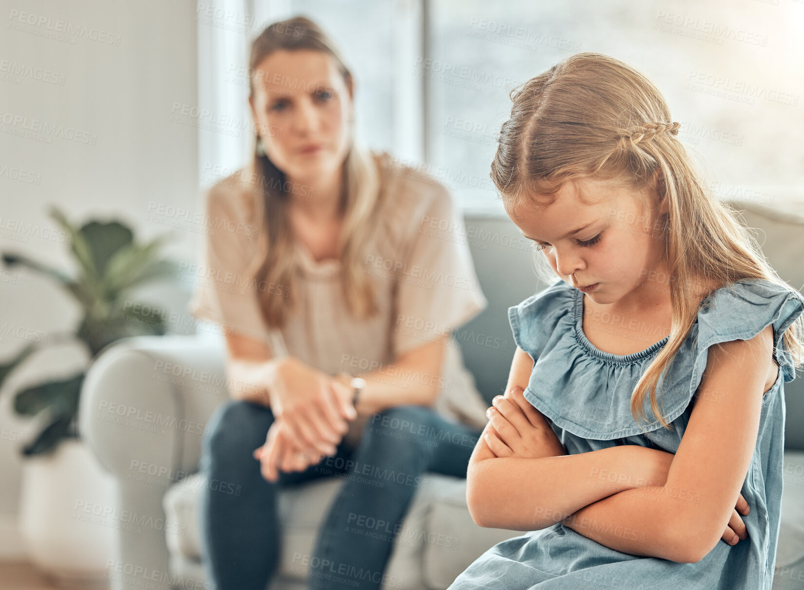 Buy stock photo Angry mom, sad child and discipline in living room, frustration and problem with naughty girl behaviour in home. Scolding, punishment and frustrated mother, stubborn kid and communication with anger.