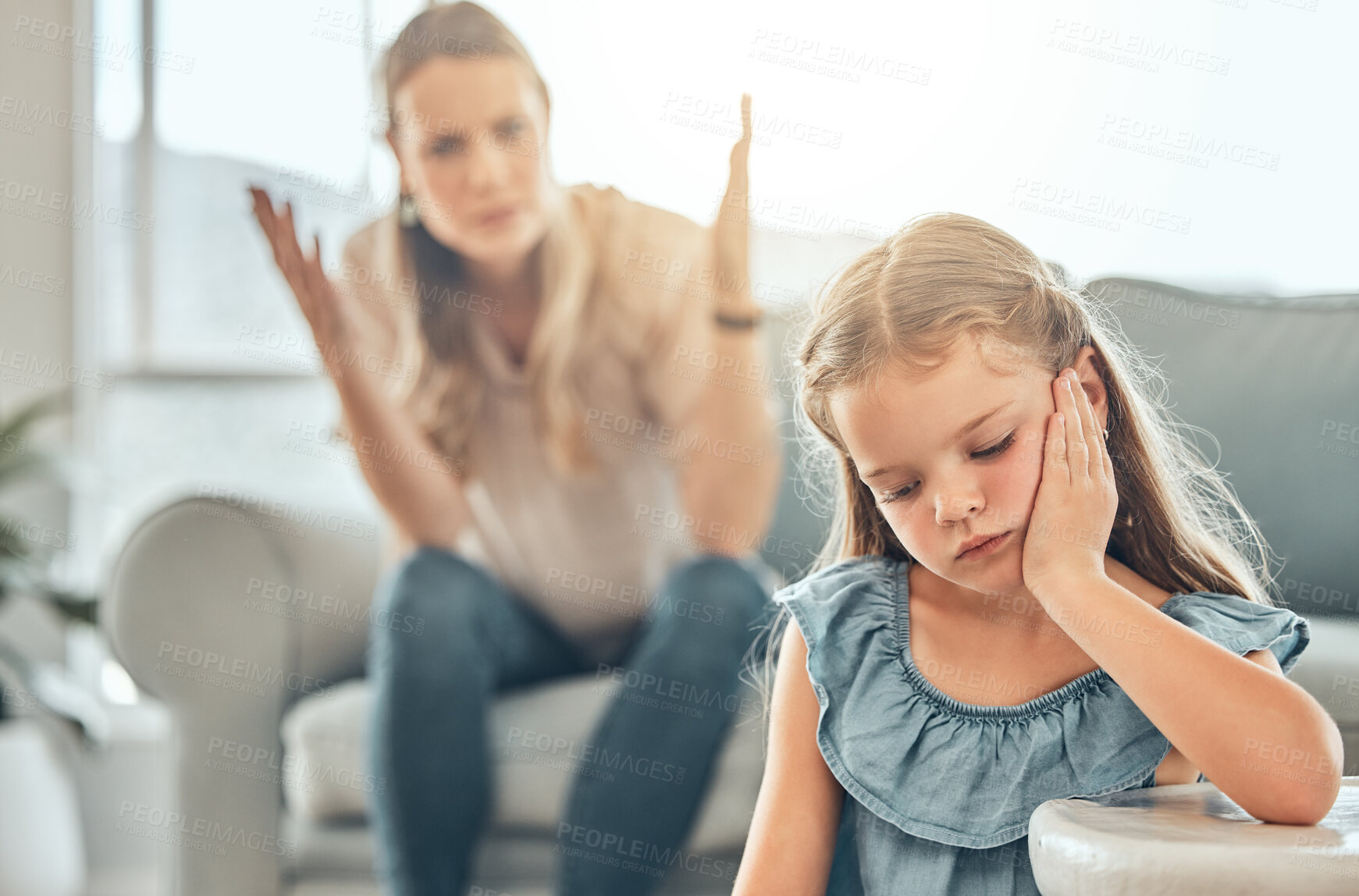 Buy stock photo Angry lecture from mother, sad child and problem with discipline in living room, naughty girl behavior in home. Scolding, punishment and frustrated woman, stubborn kid and communication with anger.