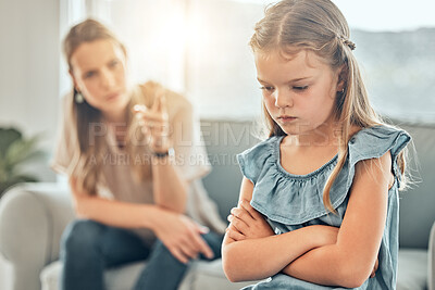 Buy stock photo Angry lecture from mom, sad child and discipline in living room, problem with naughty girl behaviour in home. Scolding, punishment and frustrated mother, stubborn kid and communication with anger.