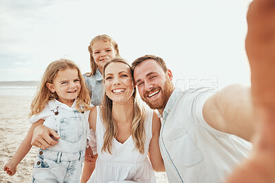 Buy stock photo Cheerful caucasian family taking selfie together on beach. Handsome man looking happy while taking picture with his wife and two daughters while on vacation 