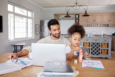 Buy stock photo An adorable mixed race girl with an afro doing her homework in the living room while her young dad works on his laptop. A father and an entrepreneur. Working at home means he's there for his daughter