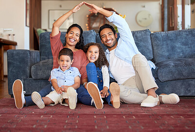 Buy stock photo Insurance, house and portrait of family in living room for protection, policy and real estate. Roof, property and security with parents and children at home for support, investment and future