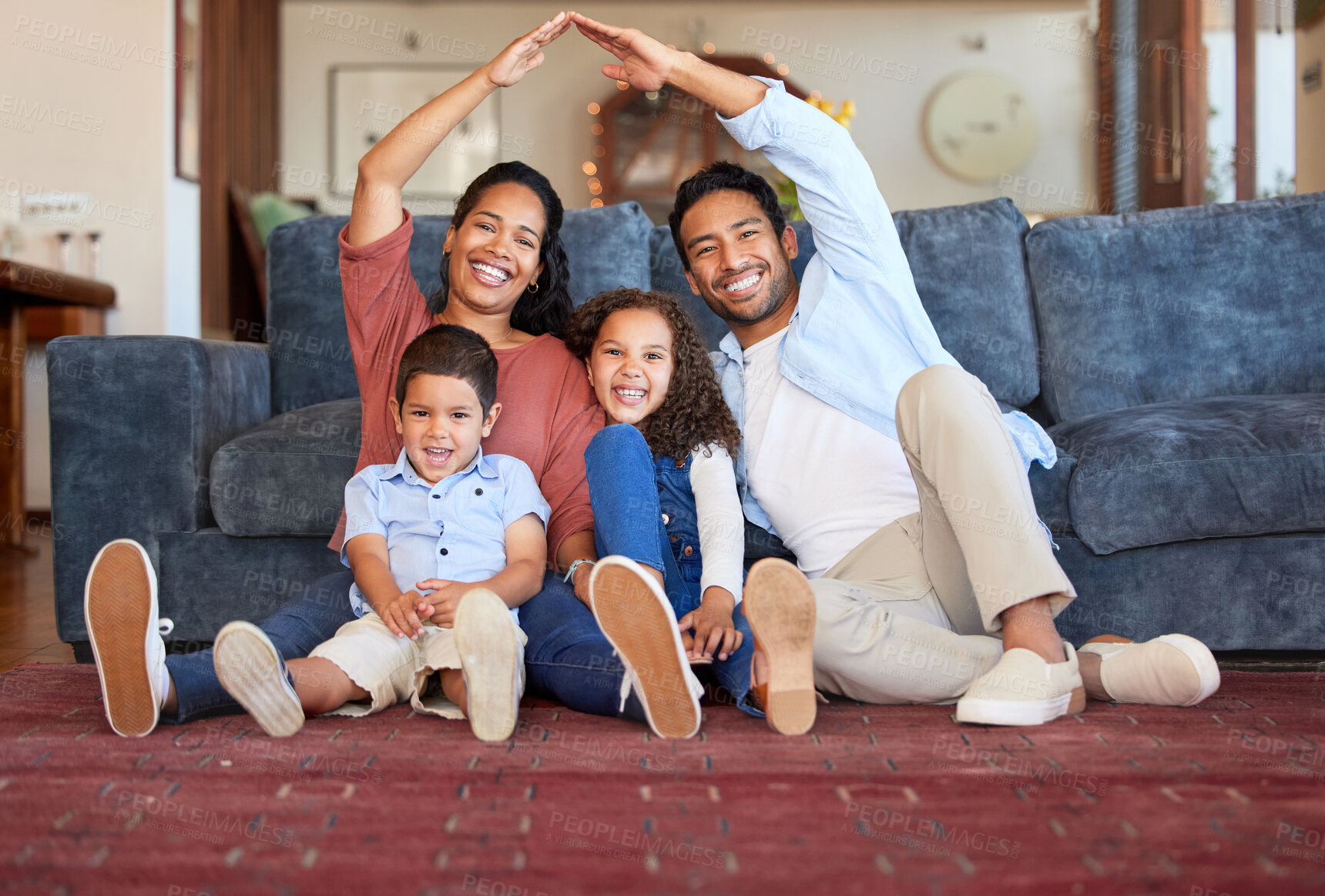 Buy stock photo Insurance, house and portrait of family in living room for protection, policy and real estate. Roof, property and security with parents and children at home for support, investment and future