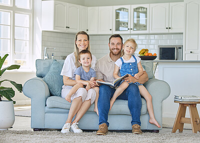 Buy stock photo Happy, love and family portrait on a sofa with book for learning, reading and bonding in their home. Face, smile and storytelling by parents and children in living room for child development indoors