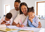 Boy and girl learning and studying through homeschool with mom and dad. Mixed race couple helping their two little kids with colouring, homework and assignments. Parents teaching children at home