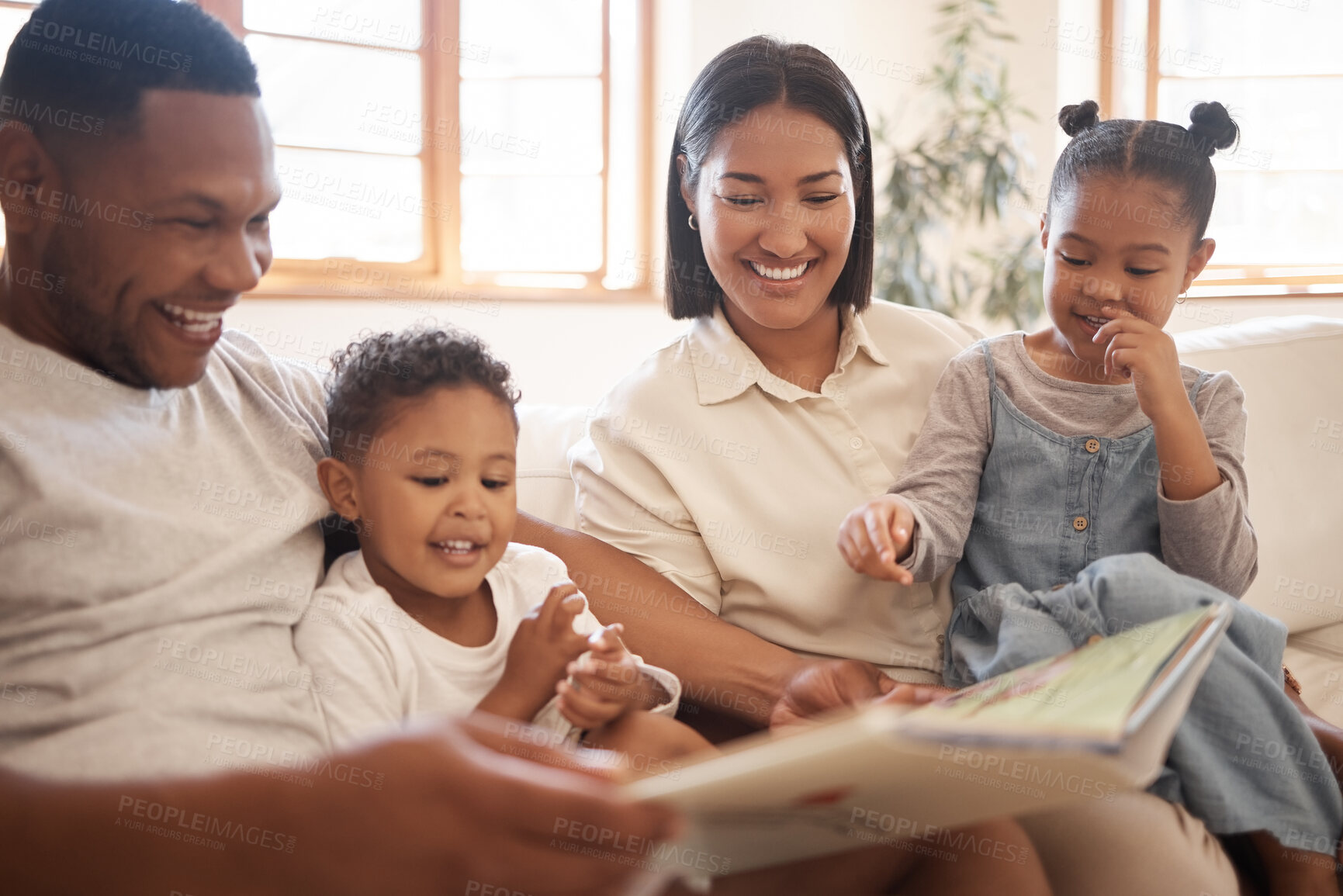Buy stock photo Funny family, reading book and education in home living room, bonding or care. Storytelling, learning and happy parents, children and multiracial father, mom and teaching, studying and laugh together