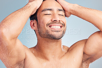 Buy stock photo Handsome hispanic man in the shower. Young man enjoying a shower in a studio. Man washing his body in the shower. Young man's bodycare routine. Happy man enjoying a hygienic shower