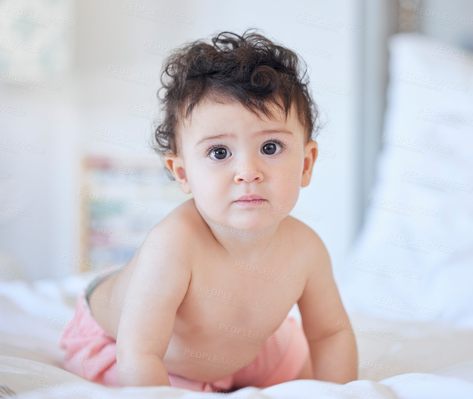 Buy stock photo Cute baby, portrait and little girl with bed for morning, awake or playing on sheets at home. Adorable infant, child or young kid in bedroom for fun playful weekend or holiday in comfort at house