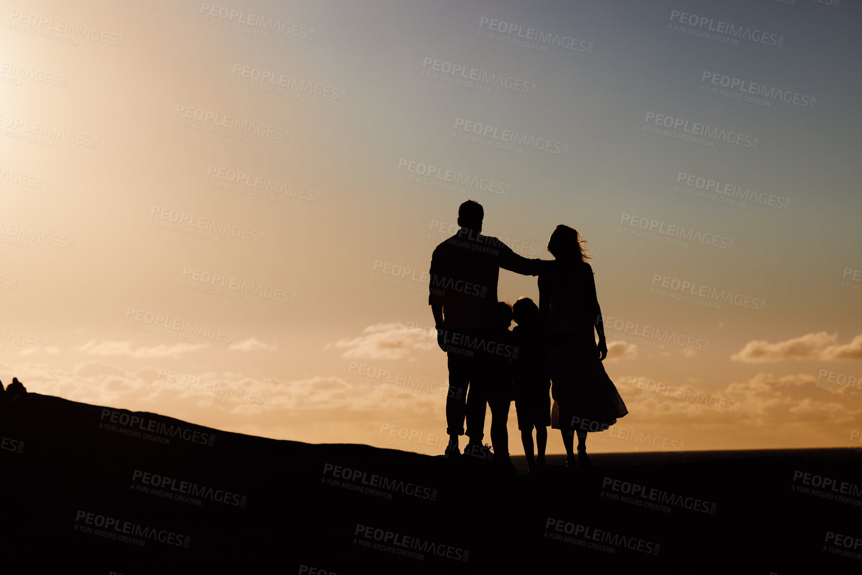 Buy stock photo Parents, kids and silhouette on mountain, sunset and hug with love, care and summer adventure. Mother, father and young children with sky background, space and outdoor on holiday, vacation or journey