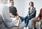 Group therapy. Therapist talking to patients together. Group of people in therapy. Diverse people talking to psychologist. People in treatment with a therapist. Counsellor in a therapy session