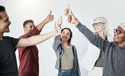 Buy stock photo Group happy of diverse businesspeople showing a thumbs up standing together in a meeting in an office at work. Men and woman smiling and holding up a thumb in agreement and support