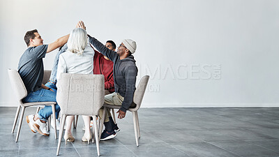Buy stock photo Diverse group of people sitting together and giving each other high five after therapy with copyspace. Full length of support group celebrating after successful session. Friends support mental health