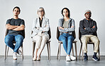 Businesspeople waiting in line for an interview. Patients sitting in line at doctor's office. Therapist sitting with patients in a row. Portrait of diverse businesspeople with arms crossed.