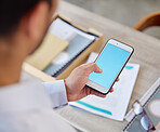 Unknown businessman browsing the internet on a cellphone in an office. Mixed race professional standing alone and scrolling through schedule and social network. Connecting with clients on technology