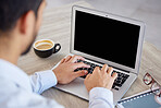 Back of businessman typing on a laptop. Business professional working in his office. Businessman typing an email on his computer. Hands of a businessman typing on his wireless tech device. 