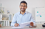 Mixed race cheerful Businessman executive writing notes on paper . Male Hispanic financial advisor smiling and sitting in a office at a startup business