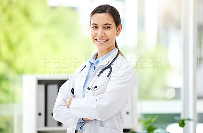 Buy stock photo Portrait, healthcare and arms crossed with a doctor woman in the hospital for insurance or treatment. Medical, happy or smile with a young female medicine professional standing alone in a clinic