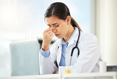 Buy stock photo Mental health, woman doctor sad and with laptop at her desk in a modern office with a lens flare. Depression or headache, problem or burnout and female nurse or surgeon fatigue at her workstation
