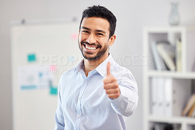 Buy stock photo Young happy handsome mixed race businessman showing a thumbs up standing in an office alone at work. One pleased hispanic male boss smiling holding up a thumb in agreement